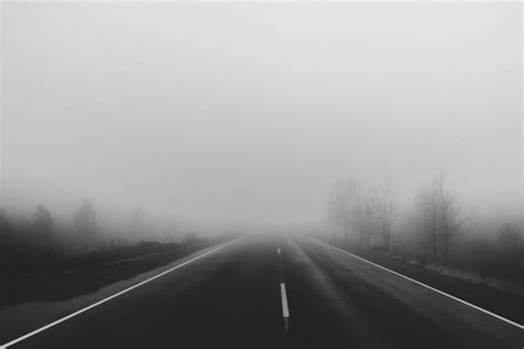 Gray Asphalt Road During Fog · Free Stock Photo