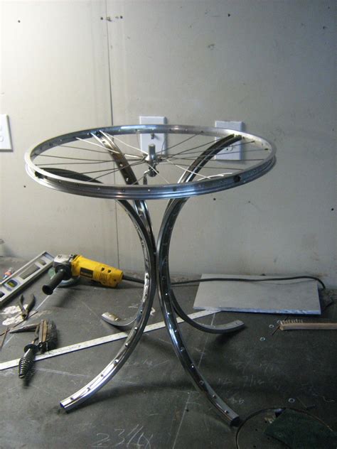 Turn the pedals, the wheels go round and hey presto. An end table I made out of a bike rim and wheel for a ...