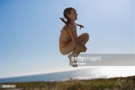 Girl Jumping Into Swimming Pool Photo Getty Images