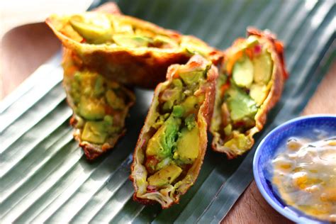 Brush the edges of the wrap with the egg wash and then carefully tuck the sides of the wrap and roll forward to close the roll. Contessa Avocado Egg Rolls - The Crucian Contessa