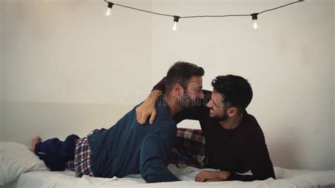 Happy Gay Men Couple Using Laptop In Bed Homosexual Love And Gender