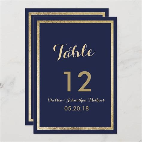 A Navy And Gold Wedding Table Number Card With The Word Table 12 On It