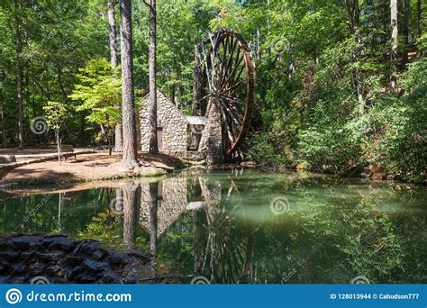 Reflection In The Pond In Front Of The Old Grist Mill At