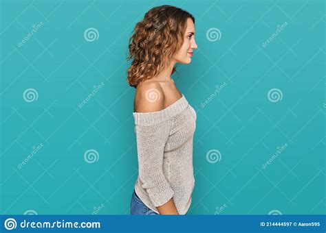 Beautiful Young Caucasian Woman Wearing Casual Clothes Looking To Side