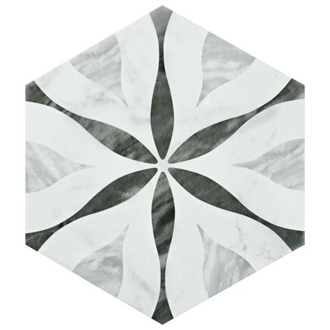 A White And Black Hexagonal Tile With An Abstract Design In The Center