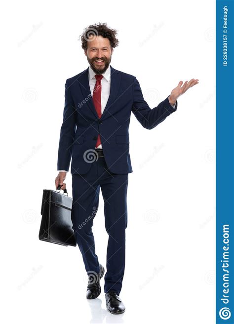 Happy Businessman Walking Towards The Camera With An Open Arm Stock