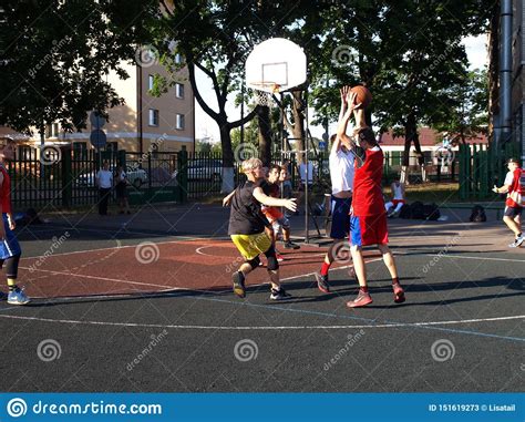 Streetball Basketball Game With Two Players Teenagers Girl And Boy
