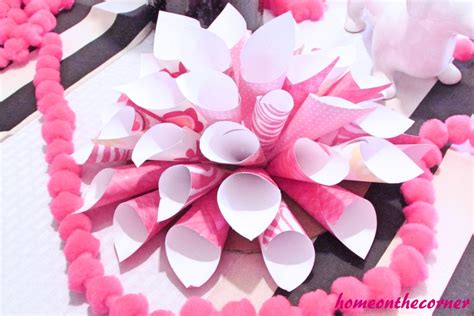Use different colored paper to create dimension and make each flower. Pink Paper Flower - HOME ON THE CORNER