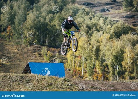 Jump Ski Racer On The Mountain Bike In Downhill Race Editorial Image
