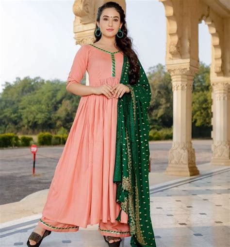 The combination of the soft pink and pastel blue colour is one that catches eye quite easily. peach colour kurti salwar kameez peach colour Combinations ...