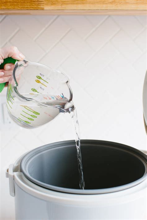 The ratio of rice to water is 1:1.25 (same as brown rice). How To Make Rice in a Rice Cooker | Kitchn