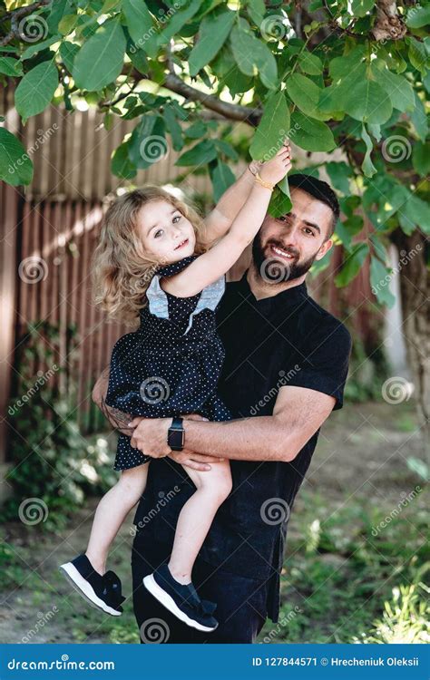 Dad Hold His Little Daughter In His Arms Stock Image Image Of Outdoor