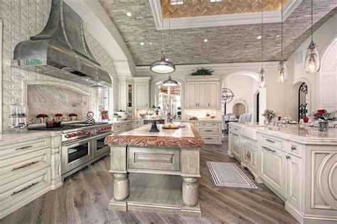 Luxury French Villa Custom Home Kitchen With White Wood And Wood Floors
