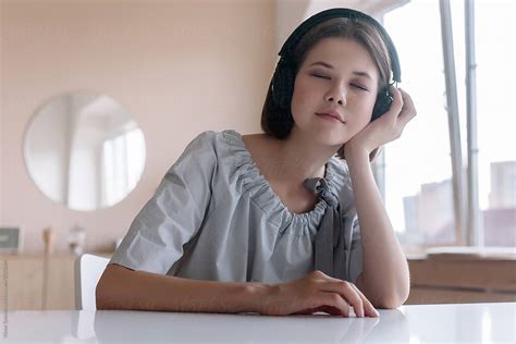 Beautiful Closeup Portrait Of Cute Asian School Girl Listening Music With Headphones By