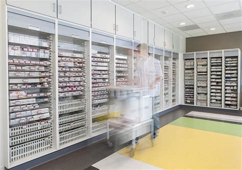 More importantly, there is wasted aisle space between each row of stationary of pharmacy storage cabinets that is highly valuable and underutilized. Pharmacy Movable Casework Cabinets | Medical Millwork ...