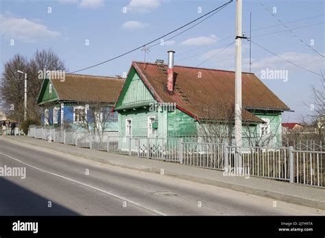 Traditional Wooden Houses Along A Road In A Village In Belarus Stock