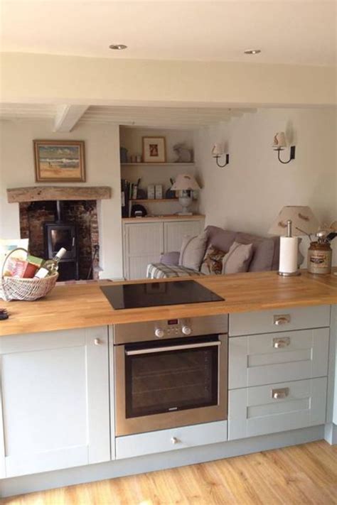 Kitchen islands with breakfast bars become the hub where homework can be done whilst catching up with the day's news. Pin by Sue Pidd on Build ideas | Small cottage kitchen ...