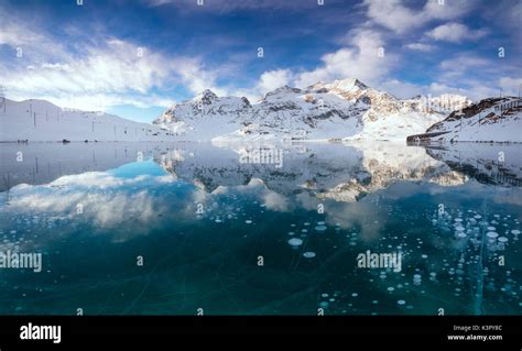 Panorama Of Ice Bubbles And Frozen Surface Of Lago Bianco At Dawn