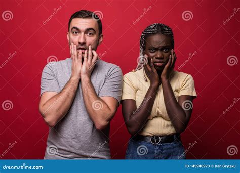 Portrait Of Shocked Interracial Couple African Woman And Caucasian Man Standing Together
