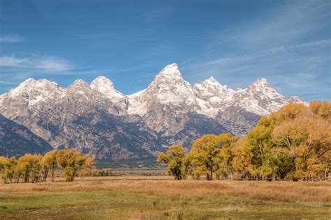 The most common snow capped mountain material is metal. Snow Capped Mountains Photograph by Kristina Rinell
