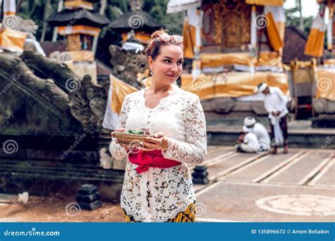 bali indonesia december 26 2018 european woman in traditional dress on balinese ceremony in