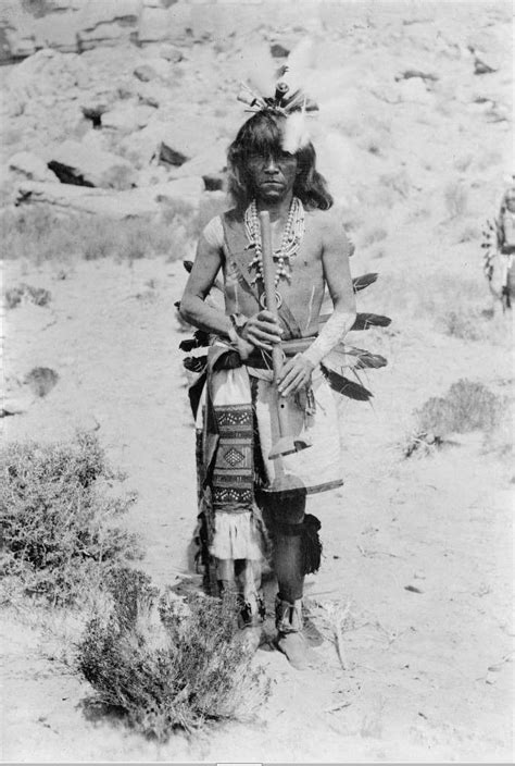 Hopi Holding A Flute In The Mishongnovi Village In Arizona In 2023