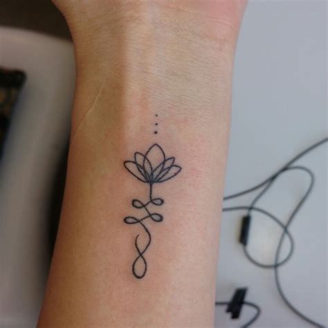 They represent divinity and purity and would be a great tattoo choice anywhere in the body. Lotus flower unalome tatoo | Wrist tattoos for women ...