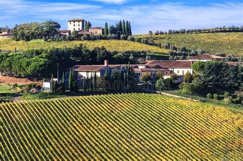 Impressive Landscape Of Tuscanyview With Colorful Vineyards And Farm