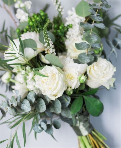 White wedding bouquets are a truly classic and timeless option you're sure to look back on in ten years with the same level of fondness you felt on the day you said i. Green and white spring wedding bouquet by ...
