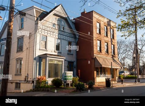 Two old buildings, one for sale, with store fronts on Ellsworth Avenue