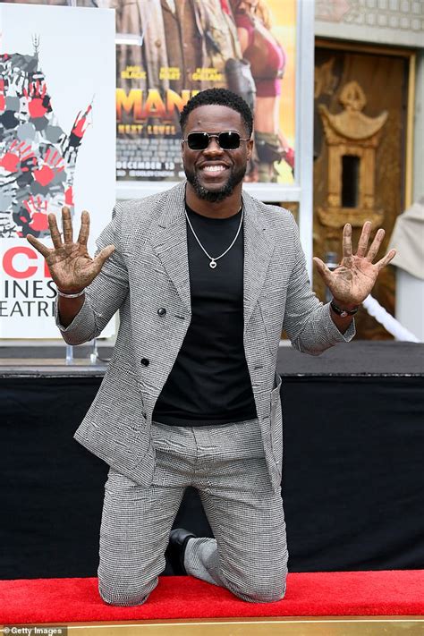 Kevin Hart gets a big kiss from co-star Dwayne 'The Rock' Johnson