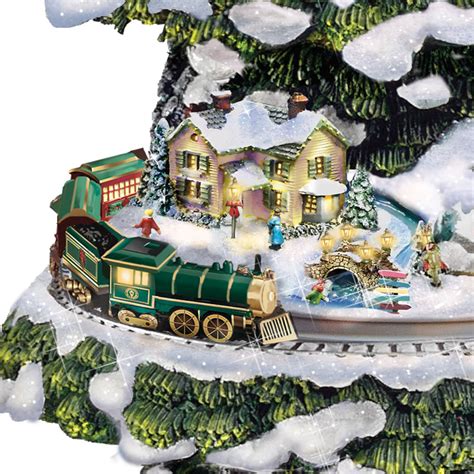 The great thing about christmas train ornaments is that it usually fits any theme you intended for your home decoration. The Thomas Kinkade Animated Christmas Tree - Hammacher ...