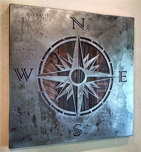 The effects of shearing on the material change as the cut progresses and are visible on the edge of the sheared material. COMPASS ROSE wall art Metal Art Reclaimed by LegendaryFineArt