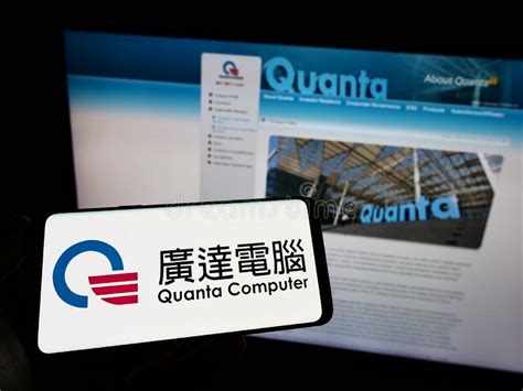 Person Holding Smartphone With Logo Of Taiwanese Company Quanta