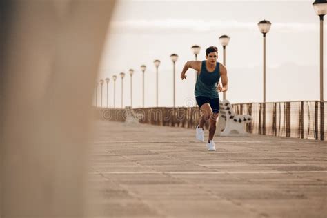 Fit Young Man Running Fast On The Promenade Stock Image Image Of