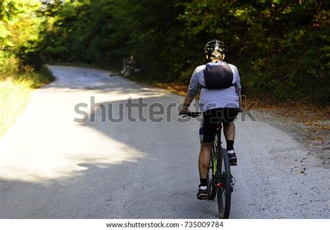 Person Riding Bicycle Uphill Stock Photo 735009784 Shutterstock