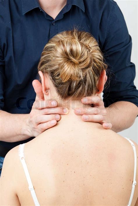 Massage Therapist Giving A Massage Female Receiving Professional Massage Series Stock Image
