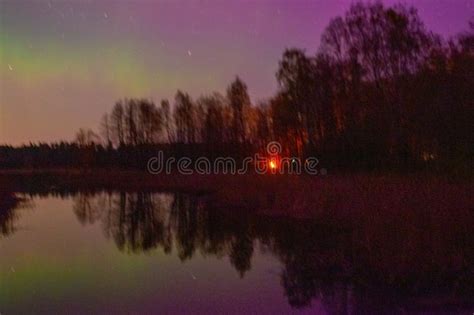 Northern Lights And Its Reflection The Lake Northern Lights Shimmer