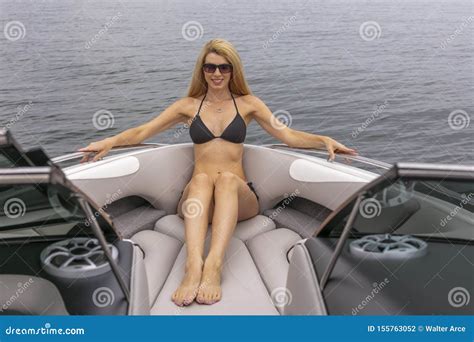 Beautiful Bikini Model Relaxing On A Boat By The Docks Stock Photo Image Of Adult Attractive