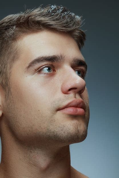 Free Photo Close Up Portrait Of Young Man Isolated On Grey Studio