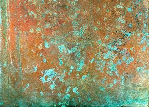 An Old Rusted Metal Surface With Blue And Green Paint