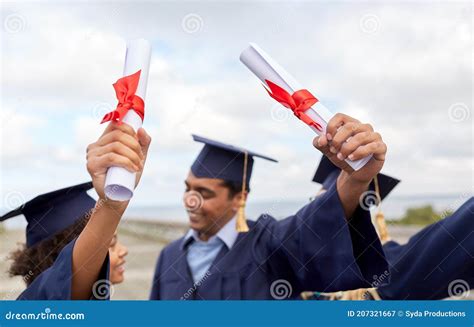 Graduate Students In Mortar Boards With Diplomas Stock Image Image Of