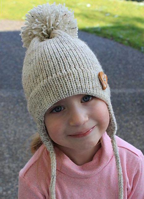 Learn how to make this knitted baby hat with pom pom in garter stitch. Ravelry: child's earflap hat on the midgauge by Mar Heck ...