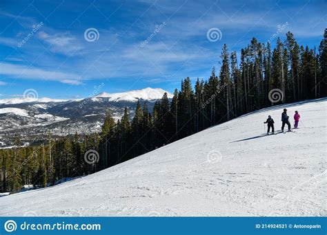 Group Of People On Snowy Hill Active Winter Vacation Stock Image