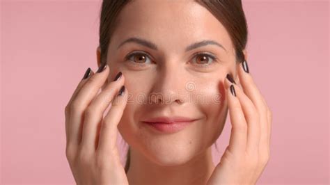 30s Brunette Woman Makes A Facial Massage Self Care Concept Stock