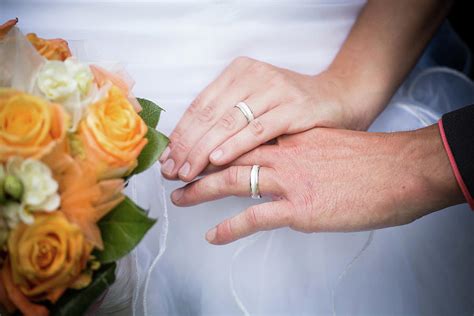 Young Married Couple Holding Hands Ceremony Wedding Day Photograph By