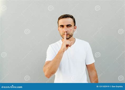 Shhh Gesture Young Man Dressed In White Casual T Shirt Pressing Finger