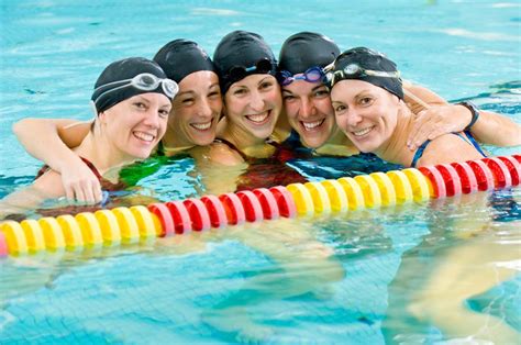 Women Swimmers Posing In Huddle In Pool Nsm Sports Insurance