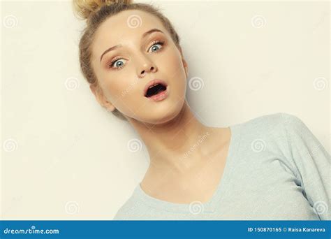 Indoor Shot Of Stupefied Shocked Blonde Woman Keeps Mouth Widely Opened