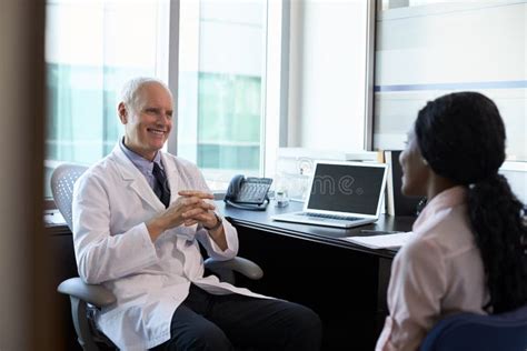 Doctor In Consultation With Female Patient Stock Image Image Of